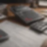 A calculator and financial documents on a desk