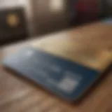 Close-up view of a credit card with business-related items in the background.
