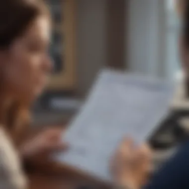 A person examining insurance policy documents.