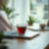 A serene workspace with a laptop and a cup of tea, symbolizing low-stress work environment.