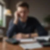 A person contemplating financial options with bills and a calculator