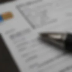 A close-up view of a credit card application form with a pen
