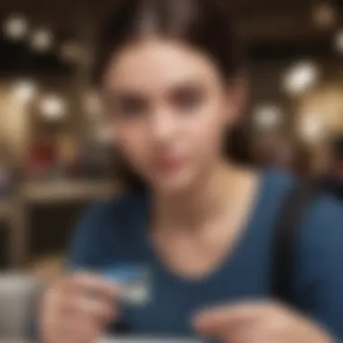 Teen Online Shopping with Prepaid Credit Card Teen using a prepaid credit card for online shopping