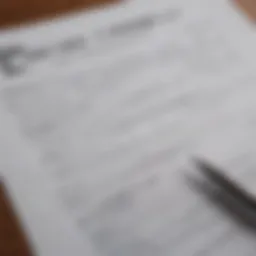 A close-up view of an auto loan application form with a pen placed on top.
