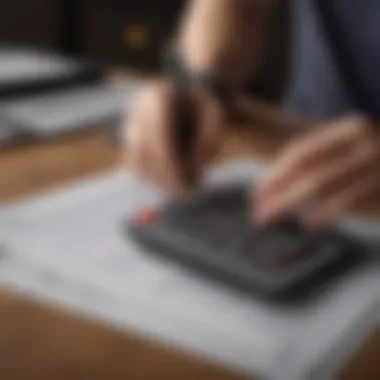 A person reviewing financial documents with a calculator.